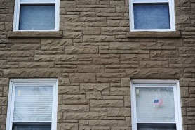 A flag is shown in a window Sept. 28, 2016 at The Veterans Group in Philadelphia, Pa. The non-profit is committed to promoting the health and well-being of former armed forces service members.